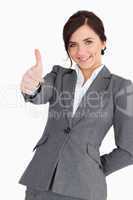 Beautiful young businesswoman the thumb-up