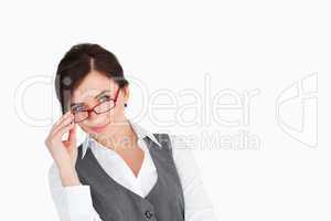 Beautiful businesswoman holding her glasses