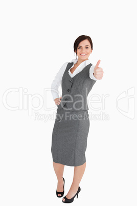 Happy well-dressed woman the thumb-up