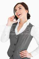 Happy well-dressed woman calling with a smartphone