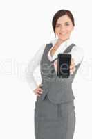 Attractive businesswoman showing her smartphone screen