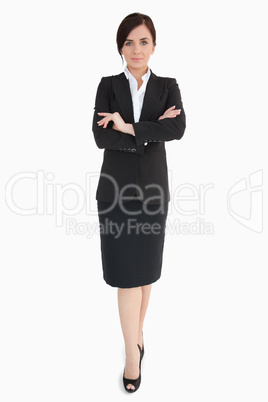 Woman in black suit with folded arms