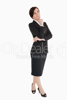 Woman in black suit thinking
