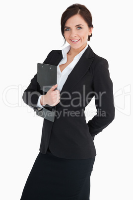 Smiling businesswoman holding a clipboard