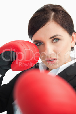 Beautiful woman boxing with red gloves