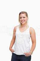 Relaxed blonde woman placing her hands in her pockets