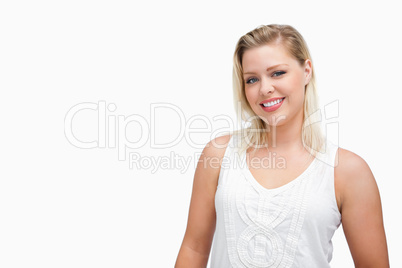 Smiling blonde woman standing upright