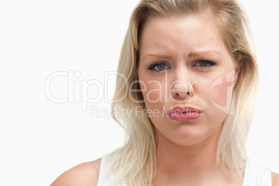 Upset blonde woman staring at the camera