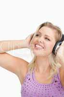 Cheerful woman wearing headphones