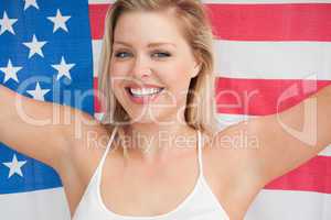 Cheerful woman holding the American flag