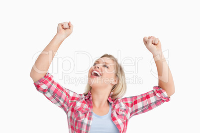 Happy woman raising her two fists