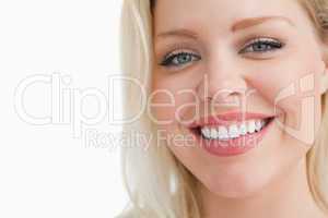 Smiling blonde woman staring at the camera