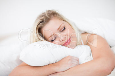 Blonde smiling while sleeping