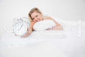 Woman getting her alarm clock