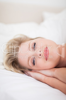 Young woman smiling while she is drowsy