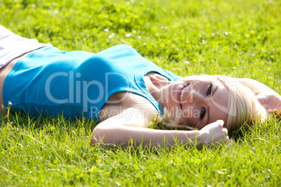 Happy woman relaxing in the sun