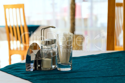 table in a cafe with salt pepper and toothpicks