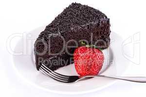 Slice of chocolate cake with strawberries.