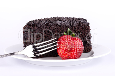 Slice of chocolate cake with strawberries.