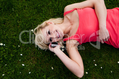 Smiling woman talking on her mobile phone