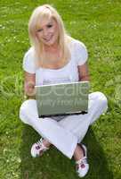 Young pretty blonde with a laptop