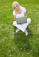 Young pretty blonde with a laptop