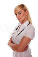 Young blonde attractive doctor with arms crossed