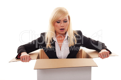 Scared young blonde getting out from a box