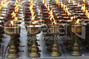 Candles burning in a Buddhist temple.