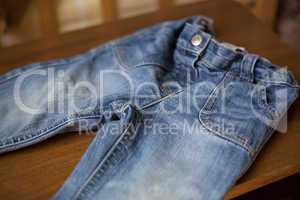 Denim blue jeans pocket on wood table