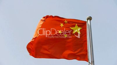 Chinese flag flutters in wind.