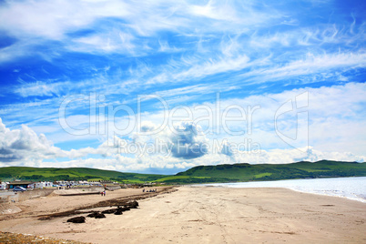 Girvan,  Scotland, sunny beach with people relaxing