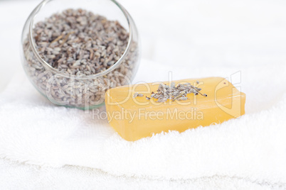 soap and lavender on a white towel