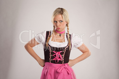 young blond angry woman with dirndl costume