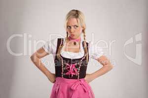 young blond angry woman with dirndl costume