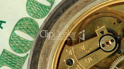 dollar and the old pendulum clock. loopable.