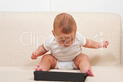 Baby using small computer