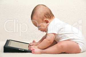 Baby with a small computer