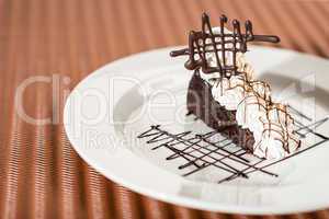 Sacher cake with whipped cream and chocolate