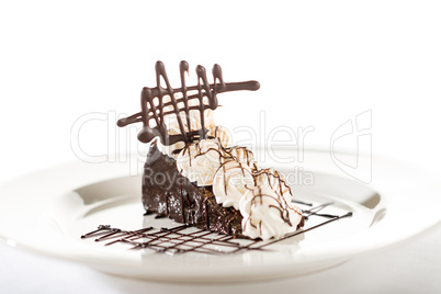 Sacher cake with whipped cream and chocolate