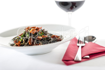 Italian style spaghetti with dried tomato, garlic