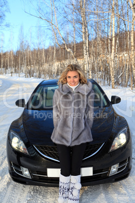 Young woman near the car