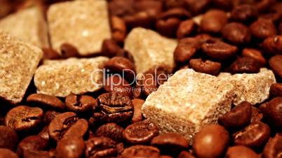 Grains of coffee and pieces of reed sugar