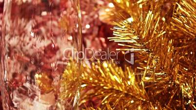 Champagne against a gold fur-tree