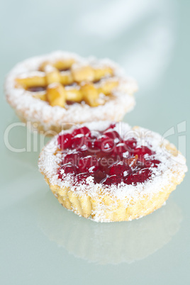 beautiful cake with berries on glass table