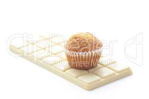 bar of white chocolate and muffin isolated on white