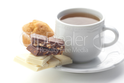 bar of chocolate,tea and muffin isolated on white