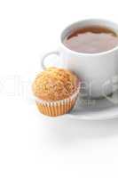 cup of tea and muffin isolated on white