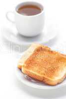 tea and toast isolated on white