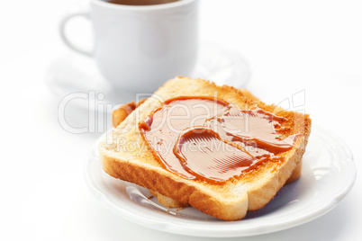 tea and toast with caramel isolated on white